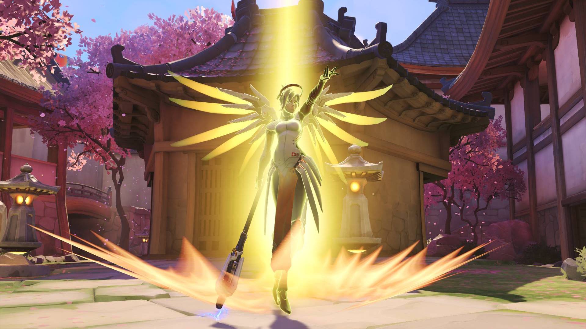 Mercy from Overwatch performs a resurrection spell in front of a pagoda house framed by cherry blossoms