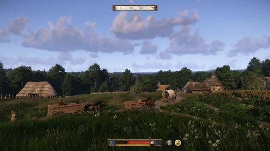 Kingdom Come Deliverance 2 preview: scenic view of several rural homes and a wagon caravan trekking over a dirt road.